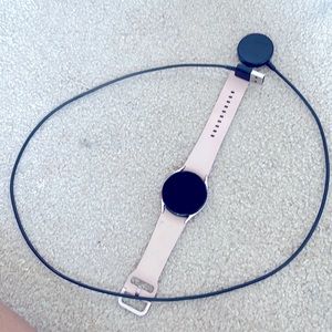 Samsung galaxy watch, rose color 20mm band, and charger